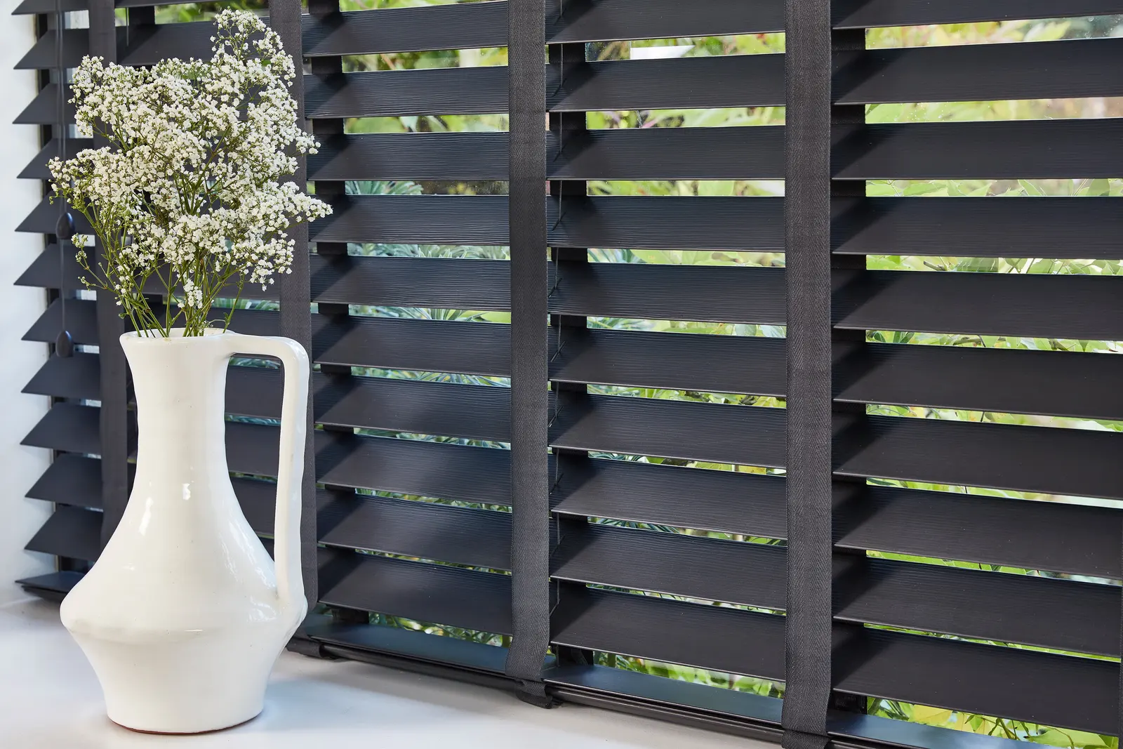 Faux wood slat blinds at a window – Erdington Blinds